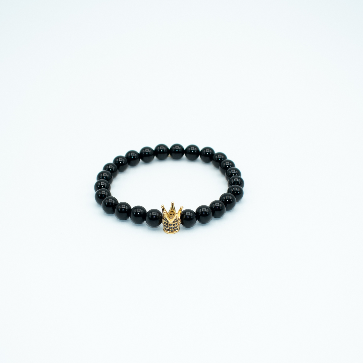 PRODUCT DETAILS  8mm&nbsp;Black Onyx Beads Gold Finish Crown Charm Stretch  7.5 Inches 0.9oz Handmade in USA We use premium durable materials and stones in our jewelry. All pieces may vary slightly in color, shape, and size. Please measure your wrist before you make your purchase for an accurate fit.&nbsp;Please leave a message if you need a different size. You will receive a free: Storage box or bag and cleaning cloth with your order.