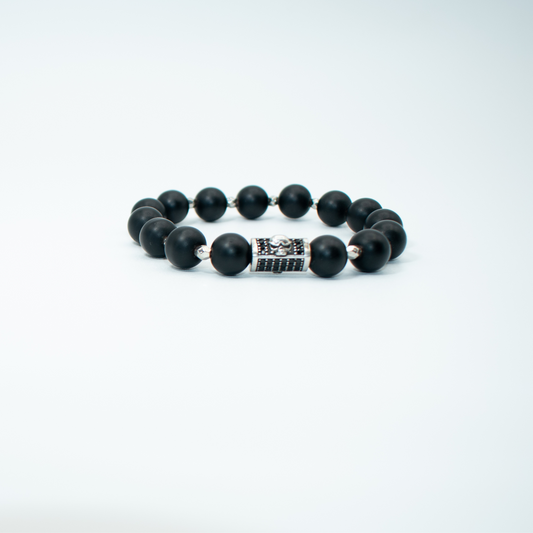 PRODUCT DETAILS  10mm Matte Black Onyx Beads Silver/Black Skull Charm Stretch&nbsp; 7.5 Inches 1.2 oz Handmade in USA We use premium durable materials and stones in our jewelry. All pieces may vary slightly in color, shape, and size. Please measure your wrist before you make your purchase for an accurate fit. Please leave a message if you need a different size.  You will receive a free: Storage box or bag and cleaning cloth with your order.