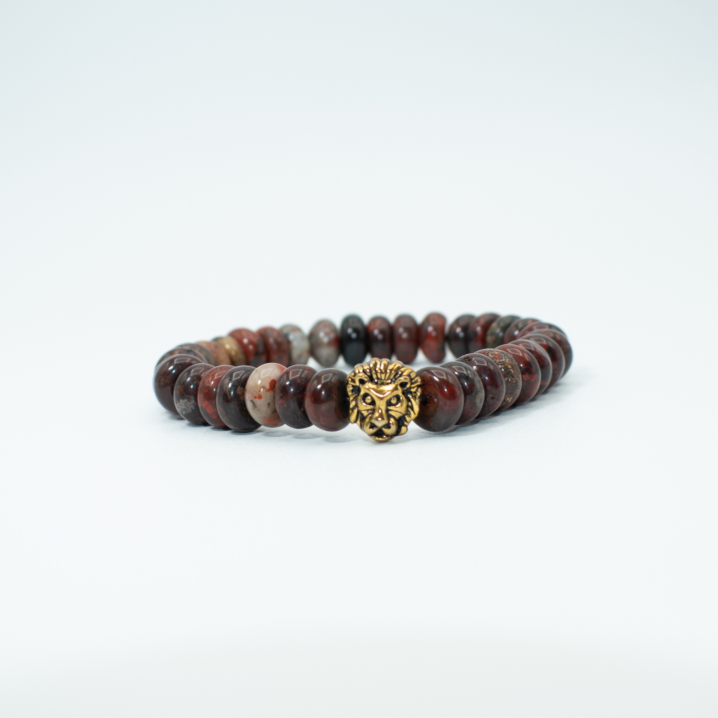 PRODUCT DETAILS  Red River Jasper Rondelle Beads Gold Finish Lion Charm Stretch&nbsp; 7.5 Inches 1.3oz Handmade in USA We use premium durable materials and stones in our jewelry. All pieces may vary slightly in color, shape, and size. Please measure your wrist before you make your purchase for an accurate fit. Please leave a message if you need a different size.  You will receive a free: Storage box or bag and cleaning cloth with your order.