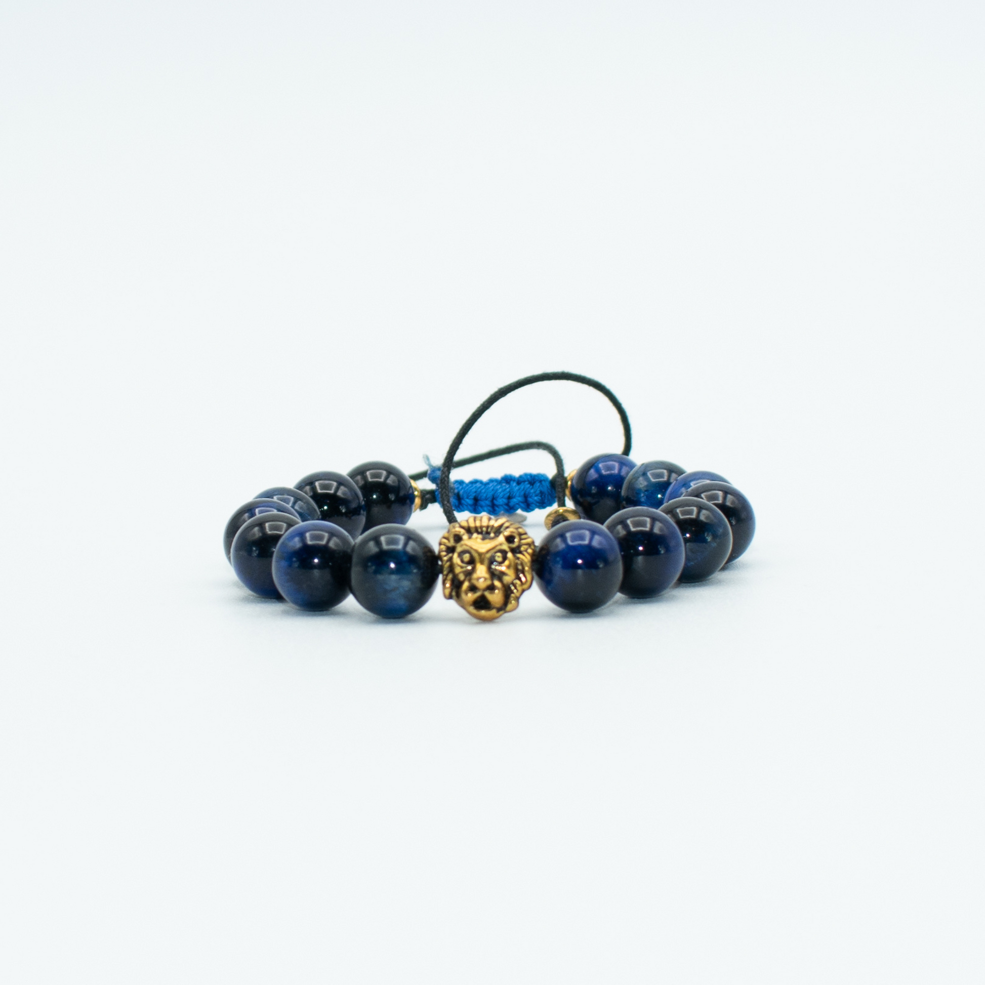 PRODUCT DETAILS   10mm Blue Tiger Eye Gold Finish Lion Charm Blue Adjustable 0.9oz Handmade in USA We use premium durable materials and stones in our jewelry. All pieces may vary slightly in color, shape, and size. Please measure your wrist before you make your purchase for an accurate fit.&nbsp;  You will receive a free: Storage box or bag and cleaning cloth with your order.