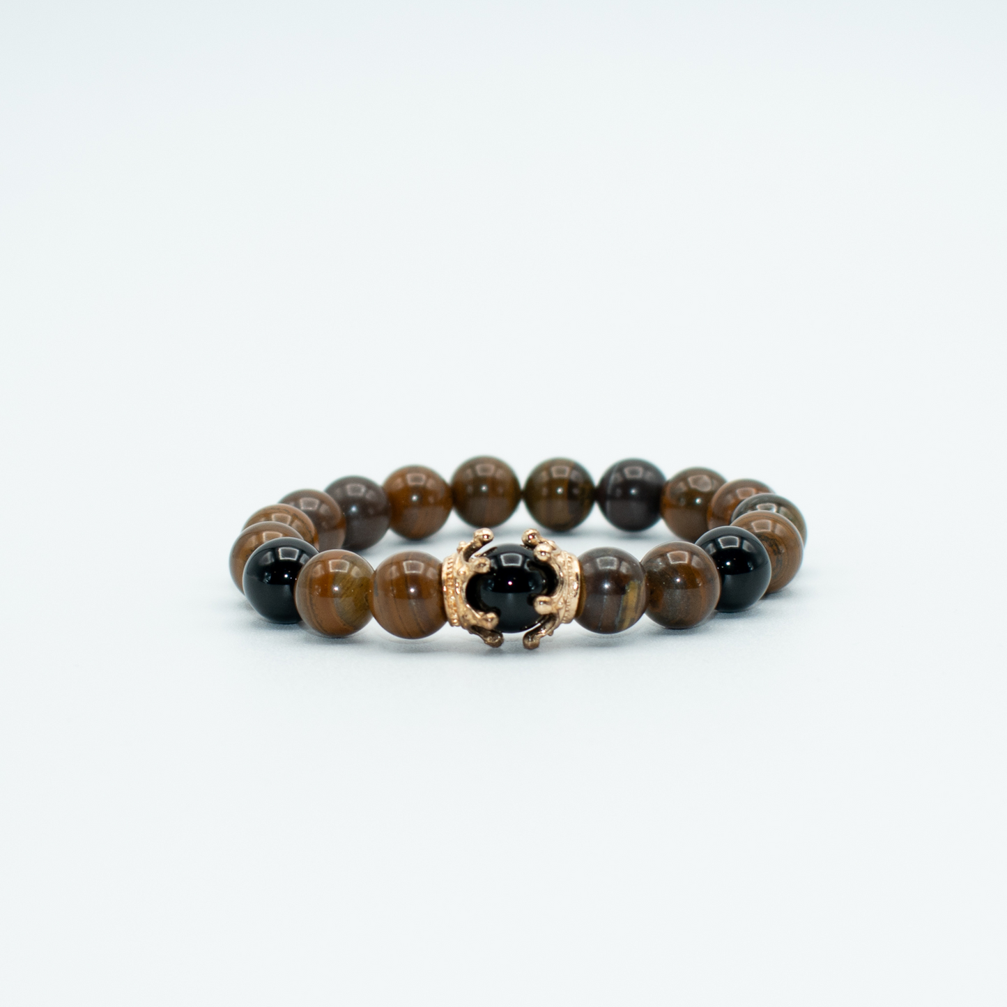 PRODUCT DETAILS  10mm Glossy Tiger Eye Stones 2 Gold Finish Crowns Stretch&nbsp; 7.5 Inches 1.5oz Handmade in USA We use premium durable materials and stones in our jewelry. All pieces may vary slightly in color, shape, and size. Please measure your wrist before you make your purchase for an accurate fit. Please leave a message if you need a different size.  You will receive a free: Storage box or bag and cleaning cloth with your order.