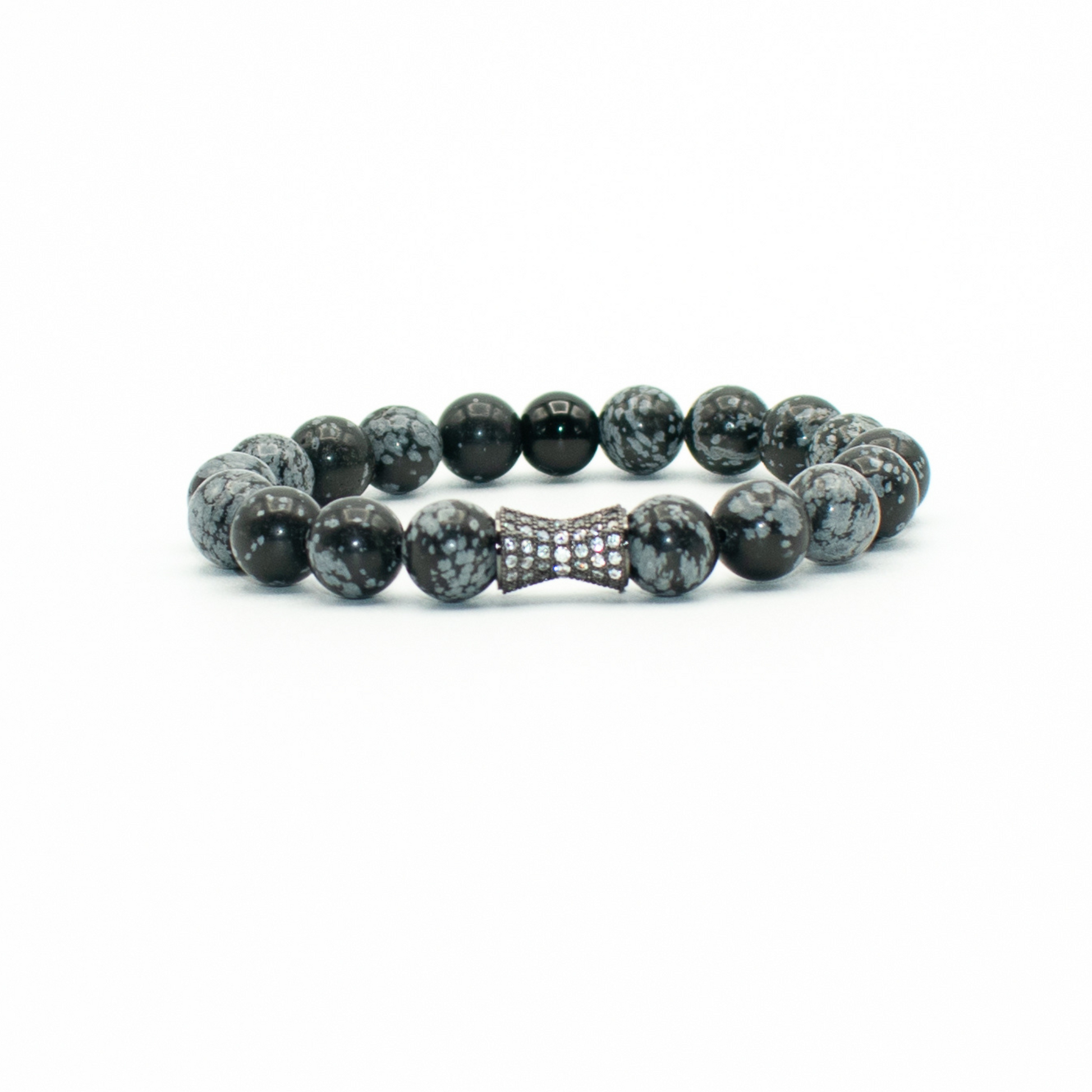 PRODUCT DETAILS  10mm SnowFlake Obsidian Rhinestone Charm Stretch&nbsp; 7.5 Inches 1.1 oz Handmade in USA We use premium durable materials and stones in our jewelry. All pieces may vary slightly in color, shape, and size. Please measure your wrist before you make your purchase for an accurate fit. Please leave a message if you need a different size.  You will receive a free: Storage box or bag and cleaning cloth with your order.