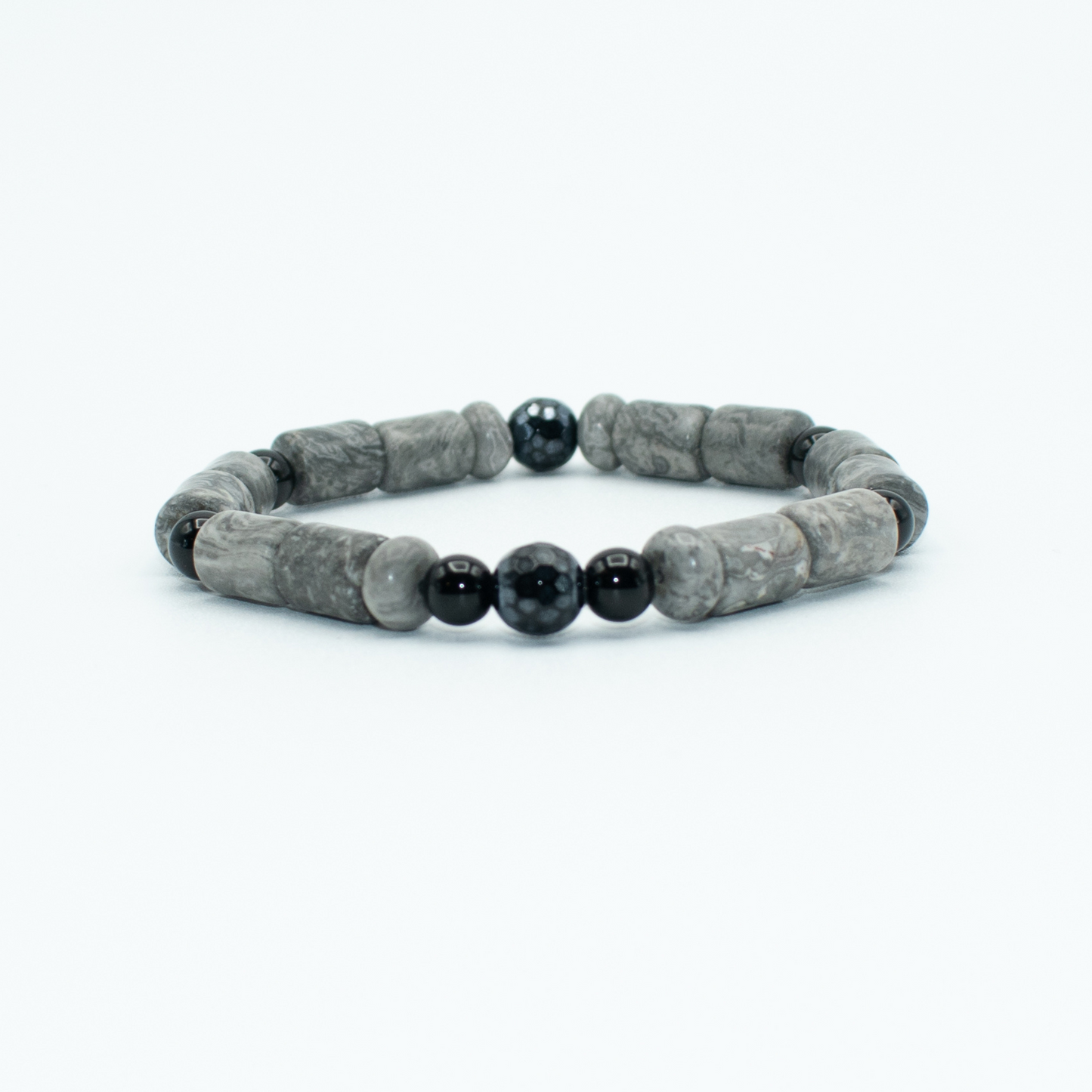 PRODUCT DETAILS  10mm SnowFlake Obsidian and Glossy Onyx Stones Stretch&nbsp; 7.5 Inches 0.8 oz Handmade in USA We use premium durable materials and stones in our jewelry. All pieces may vary slightly in color, shape, and size. Please measure your wrist before you make your purchase for an accurate fit. Please leave a message if you need a different size.  You will receive a free: Storage box or bag and cleaning cloth with your  order