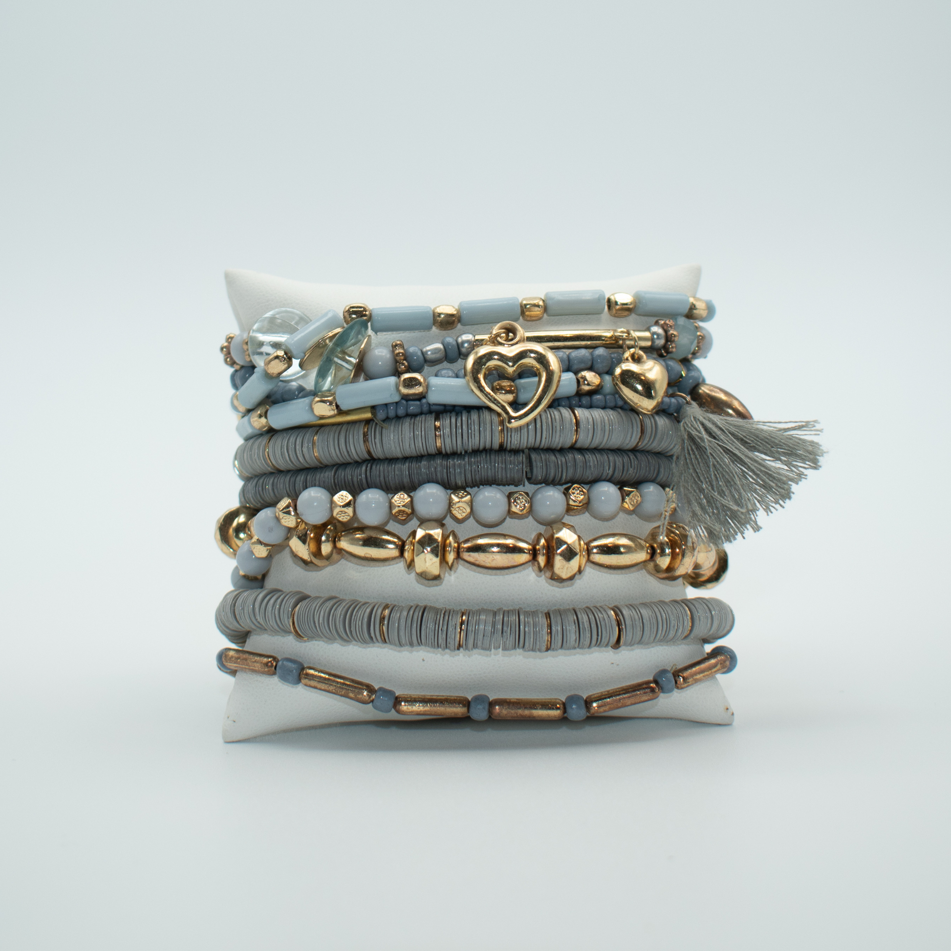 PRODUCT DETAILS  11 Layer Bracelet Stack Mixed beads with Assorted Charms 60% Wood Beads, 20% Plastic, 20% Metal Blue and Gold Color Stretch Approx. l9” Diameter 2.5” 2.02 oz. Imported Loose fit Please measure your wrist before you make your purchase for an accurate fit.&nbsp;  You will receive a free: Storage box or bag and cleaning cloth with&nbsp;