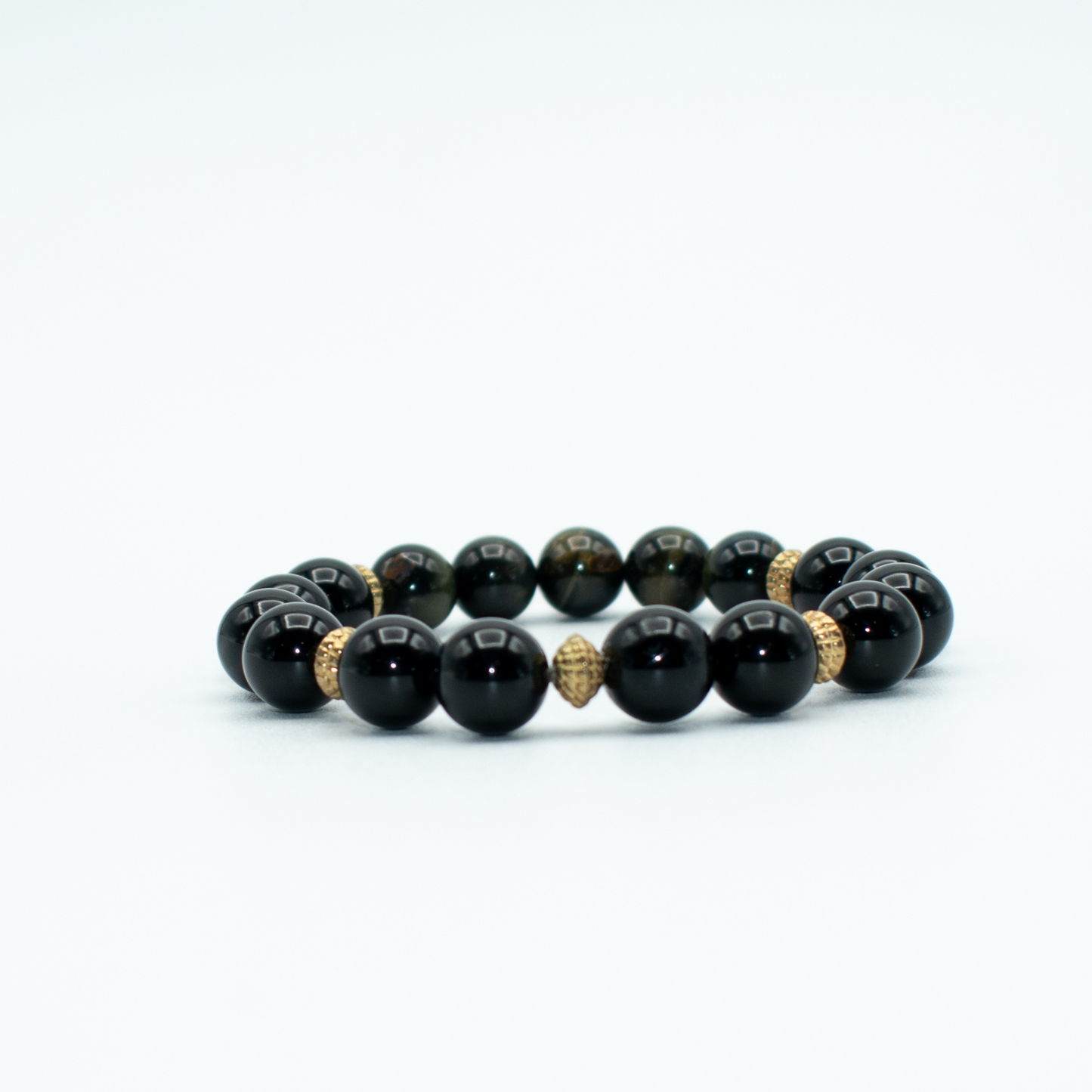 PRODUCT DETAILS   8mm&nbsp;Golden Obsidian Beads 8mm Onyx Beads 1.2 oz Handmade in USA We use premium durable materials and stones in our jewelry. All pieces may vary slightly in color, shape, and size. Please measure your wrist before you make your purchase for an accurate fit. This is a final sale item. No refunds, no exchanges, no returns. You will receive a free: Storage box or bag and cleaning cloth with your order.