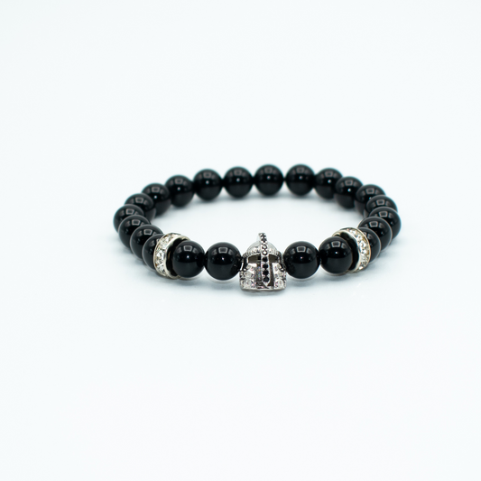 PRODUCT DETAILS  8 mm Black Onyx Stones Spartan Helmet Charm Stretch 7.5 inches 0.6 oz Handmade in USA We use premium durable materials and stones in our jewelry. All pieces may vary slightly in color, shape, and size. Please measure your wrist before you make your purchase for an accurate fit. Please leave a message if you need a different size. You will receive a free: Storage box or bag and cleaning cloth with this purchase.&nbsp;