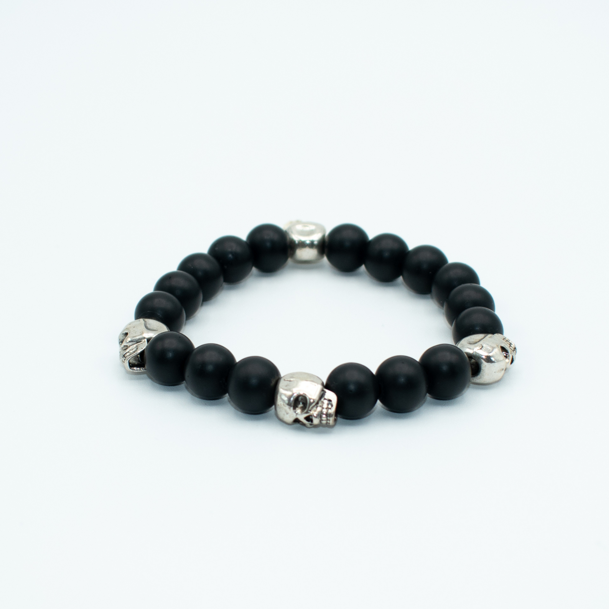 PRODUCT DETAILS  10mm&nbsp;Black Onyx Beads Silver Finish Skulls Stretch&nbsp; 7.5 Inches 1.3 oz Handmade in USA We use premium durable materials and stones in our jewelry. All pieces may vary slightly in color, shape, and size. Please measure your wrist before you make your purchase for an accurate fit. Please leave a message if you need a different size.  You will receive a free: Storage box or bag and cleaning cloth with your order.